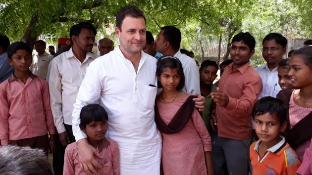 Congress president Rahul Gandhi seen with students of the Nigohi Junior School during a visit to his parliamentary constituency of Amethi in Uttar Pradesh. On Tuesday he told the people of Amethi that in 15 years, the constituency will be as developed as Singapore and California. He also accused the Centre and the Yogi Adityanath government of halting the state’s progress by taking away big projects. (Sumit Kumar / HT Photo) Congress president Rahul Gandhi seen with students of the Nigohi Junior School during a visit to his parliamentary constituency of Amethi in Uttar Pradesh. On Tuesday he told the people of Amethi that in 15 years, the constituency will be as developed as Singapore and California. He also accused the Centre and the Yogi Adityanath government of halting the state’s progress by taking away big projects. (Sumit Kumar / HT Photo)