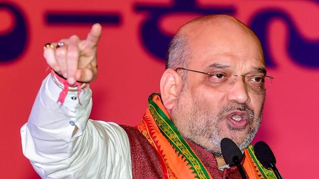 BJP president Amit Shah speaks at a meeting of Shakthi Kendra Pramukhas in Bengaluru on Wednesday. (PTI) BJP president Amit Shah speaks at a meeting of Shakthi Kendra Pramukhas in Bengaluru on Wednesday. (PTI)