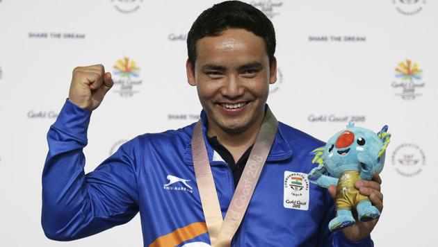 Jitu Rai of India poses with his gold medal in the men's 10m Air Pistol final at the 2018 Commonwealth Games in Gold Coast.(AP)