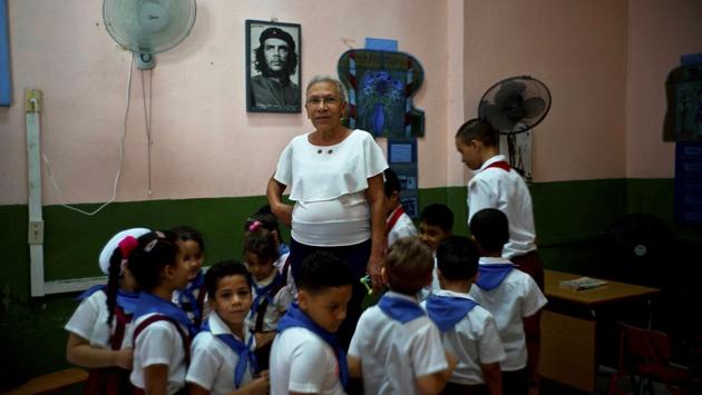 Luisa Pacheco, 65, began teaching at the age of 14 in Sierra Maestra’s rural schools. Pacheco said she likes education because she wants to train new generations for a good future and achieve what she did. On Raul Castro’s successor, she said “I hope the new president will do what our commander Fidel Castro did,” adding that she wants the US to remove its embargo to help improve the economy. (Ramon Espinosa / AP) Luisa Pacheco, 65, began teaching at the age of 14 in Sierra Maestra’s rural schools. Pacheco said she likes education because she wants to train new generations for a good future and achieve what she did. On Raul Castro’s successor, she said “I hope the new president will do what our commander Fidel Castro did,” adding that she wants the US to remove its embargo to help improve the economy. (Ramon Espinosa / AP)
