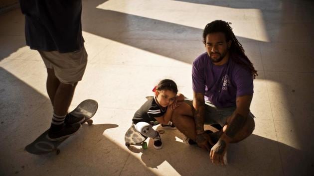 Yojany Perez, 28, with his 2-year-old daughter, at a skateboarding park in Havana. Perez, who has an economics degree but works in maintenance, said with the arrival of a new Cuban president, people are expecting an improvement in the economy, for prices to decline or salaries rise. “Our current economy does not give for many luxuries,” he said. (Ramon Espinosa / AP) Yojany Perez, 28, with his 2-year-old daughter, at a skateboarding park in Havana. Perez, who has an economics degree but works in maintenance, said with the arrival of a new Cuban president, people are expecting an improvement in the economy, for prices to decline or salaries rise. “Our current economy does not give for many luxuries,” he said. (Ramon Espinosa / AP)