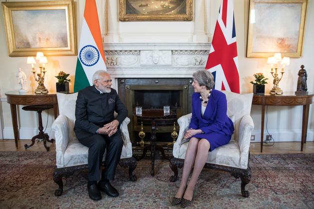 British Prime Minister Theresa May (R), speaks to Prime Minister Narendra Modi during their bilateral meeting at 10 Downing Street, London. Modi arrived in London early on Wednesday to attend the Commonwealth Heads of Government Meeting (CHOGM) as he looks to enhance India’s role in multilateral organisations. He is the first Indian PM to attend the meet in nearly a decade. (Simon Dawson / Bloomberg) British Prime Minister Theresa May (R), speaks to Prime Minister Narendra Modi during their bilateral meeting at 10 Downing Street, London. Modi arrived in London early on Wednesday to attend the Commonwealth Heads of Government Meeting (CHOGM) as he looks to enhance India’s role in multilateral organisations. He is the first Indian PM to attend the meet in nearly a decade. (Simon Dawson / Bloomberg)
