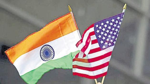 A man holds the flags of India and the U.S. while people take part in the 35th India Day Parade in New York August 16, 2015.(REUTERS File Photo)