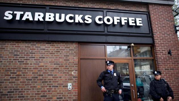 Police officers monitor activity outside as protestors demonstrate inside a Center City Starbucks, where two black men were arrested, in Philadelphia, Pennsylvania US, on April 16, 2018.(Reuters)