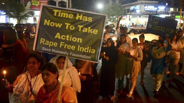Police said while one of the accused has been arrested, the woman’s father and the third accused is on the run. (Pictured) A rally against rape in Mumbai.(HT/Bachchan Kumar)