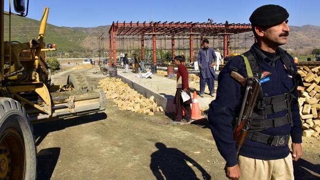 A Pakistani police officer stands guard at the site of Pakistan China Silk Road in Haripur, Pakistan. From Pakistan to Tanzania to Hungary, projects under Chinese President Xi Jinping's signature "Belt and Road Initiative" are being canceled, renegotiated or delayed due to disputes about costs or complaints host countries get too little out of projects built by Chinese companies and financed by loans from Beijing that must be repaid.(AP file) A Pakistani police officer stands guard at the site of Pakistan China Silk Road in Haripur, Pakistan. From Pakistan to Tanzania to Hungary, projects under Chinese President Xi Jinping's signature "Belt and Road Initiative" are being canceled, renegotiated or delayed due to disputes about costs or complaints host countries get too little out of projects built by Chinese companies and financed by loans from Beijing that must be repaid.(AP file)