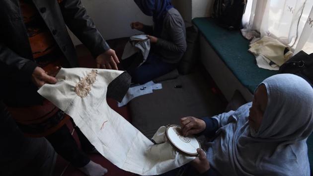 About 60% of the team at Zarif is female, including the director Nasima along with the production manager Sara. Two embroiderers work full time while an additional 30 are called on at the discretion of the managers. (Wakil Kohsar / AFP) About 60% of the team at Zarif is female, including the director Nasima along with the production manager Sara. Two embroiderers work full time while an additional 30 are called on at the discretion of the managers. (Wakil Kohsar / AFP)