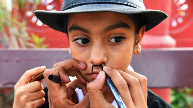 Many had used black marker pens to draw on Chaplin’s trademark toothbrush moustache while others chose to stick to fake ones. (Indranil Mukherjee / AFP) Many had used black marker pens to draw on Chaplin’s trademark toothbrush moustache while others chose to stick to fake ones. (Indranil Mukherjee / AFP)