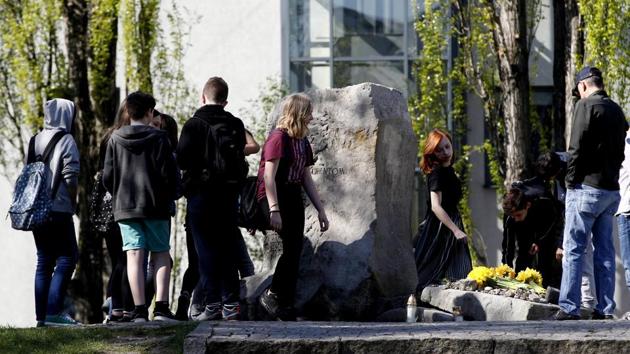 People with daffodils gather for non-official anniversary ceremonies in tribute to the fighters of the 1943 Warsaw Ghetto Uprising by the site of a wartime bunker where the last fighters, rounded by Nazi Germans, committed suicide, in Warsaw, Poland, on Thursday. (AP photo) People with daffodils gather for non-official anniversary ceremonies in tribute to the fighters of the 1943 Warsaw Ghetto Uprising by the site of a wartime bunker where the last fighters, rounded by Nazi Germans, committed suicide, in Warsaw, Poland, on Thursday. (AP photo)