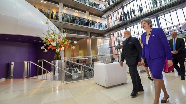 Prime Minister Narendra Modi with British Prime Minister Theresa May visits the Francis Crick Institute in London on Wednesday.(PTI Photo)