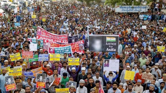 People attend a protest rally against Kathua, Unnao and Surat rape cases, in Ahmedabad on Wednesday.(PTI photo)