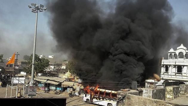 Smoke billows out of a burning bus during Bharat Bandh, called by Dalit organisations, Alwar, Rajasthan, April 2(PTI) Smoke billows out of a burning bus during Bharat Bandh, called by Dalit organisations, Alwar, Rajasthan, April 2(PTI)