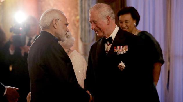 Britain's Prince Charles greets Prime Narendra Modi in a receiving line for the Queen's Dinner for the Commonwealth Heads of Government Meeting (CHOGM) at Buckingham Palace in London, on April 19, 2018.(AP)
