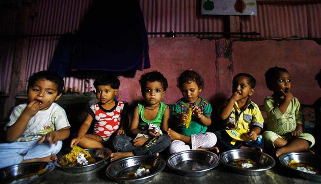 Malnourished children eat at Apanalaya, Mumbai, an organisation working for the betterment of slum children.(AP)