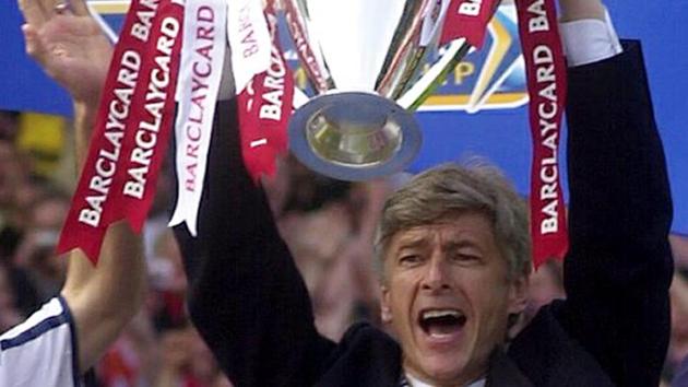 Arsene Wenger celebrates at Arsenal soccer ground in London on May 11, 2002 after beating Everton 4-3. Wenger’s will bring his 22-year stay in charge of Arsenal to a close at the end of the season. (AFP) 