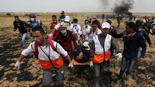 A wounded Palestinian is evacuated during clashes with Israeli troops at a protest where Palestinians demand the right to return to their homeland, at the Israel-Gaza border in the southern Gaza Strip, April 20, 2018. (REUTERS) A wounded Palestinian is evacuated during clashes with Israeli troops at a protest where Palestinians demand the right to return to their homeland, at the Israel-Gaza border in the southern Gaza Strip, April 20, 2018. (REUTERS)