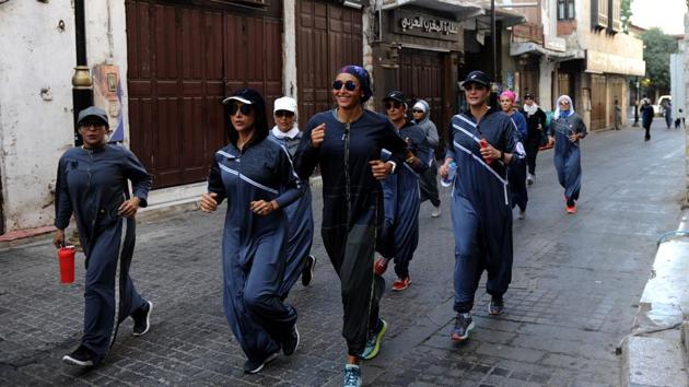 Saudi women jog in the streets of Jeddah's historic al-Balad district on March 8, 2018(AFP)