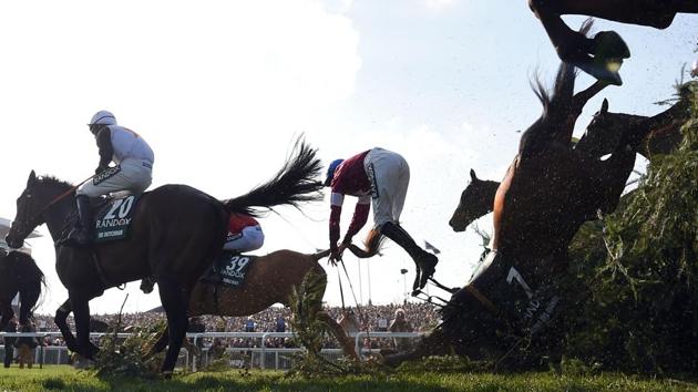 Alpha Des Obeaux unseats jockey Rachael Blackmore (C) at The Chair during the Grand National horse race on the final day of the Grand National Festival at Aintree Racecourse in Liverpool, England on April 14, 2018. (Paul Ellis / AFP)