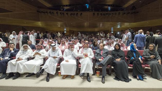 Saudi information minister Awwad Alawwad (C) attends a test screening at AMC cinema in Riyadh, the first test in over three decades.(AFP)