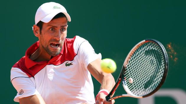 Novak Djokovic returns the ball to Austria's Dominic Thiem during their match at the Monte Carlo Masters tennis tournament.(AFP)