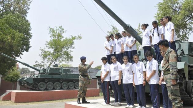 With beaming smiles and lit-up eyes, the girls did not miss the opportunity to climb on the two Vijayanta tanks kept as trophies at the entrance of the 57-year-old institution, the first army school to be opened in the country. Later, 27 other such schools were established across India. (Deepak Gupta/HT Photo) With beaming smiles and lit-up eyes, the girls did not miss the opportunity to climb on the two Vijayanta tanks kept as trophies at the entrance of the 57-year-old institution, the first army school to be opened in the country. Later, 27 other such schools were established across India. (Deepak Gupta/HT Photo)