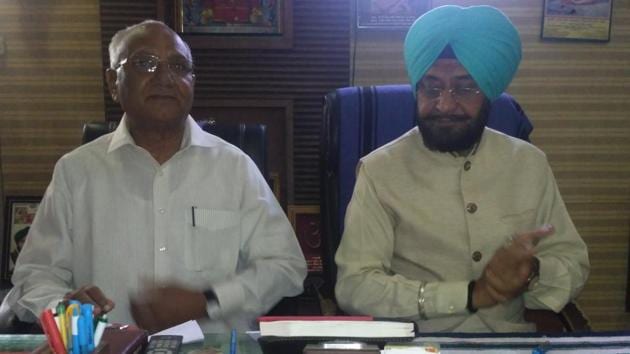 Congress MLAs Nathu Ram (left) and Surjit Dhiman interact with media in Dirba of Sangrur on Saturday.(HT Photo)