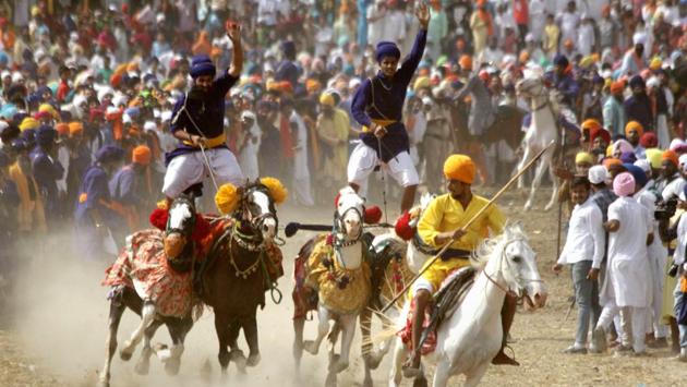 Baba Buddha Dal members perform stunts on horses on the concluding day of Baisakhi Mela at Talwandi Sabo in Bathinda on April 15, 2018. (PTI) Baba Buddha Dal members perform stunts on horses on the concluding day of Baisakhi Mela at Talwandi Sabo in Bathinda on April 15, 2018. (PTI)