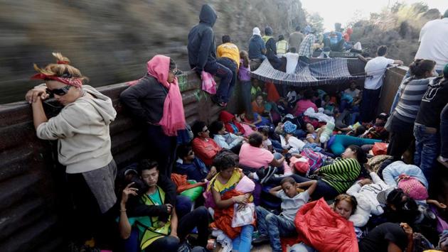 Central American migrants, moving in a caravan through Mexico, travel in an open wagon of a freight train in Hidalgo state, Mexico on April 14, 2018. (Edgard Garrido / REUTERS)