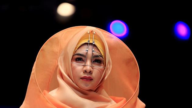 A model presents creations by student designer Sherly Az Zahra on the first day of the Indonesia Muslim Fashion Festival in Jakarta, Indonesia on April 19, 2018. (Beawiharta / REUTERS)