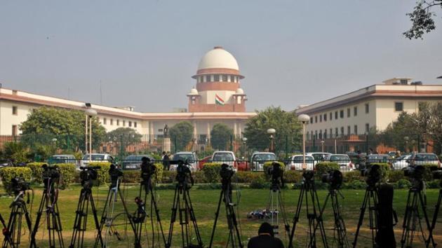 A television journalist sets his camera inside the premises of the Supreme Court in New Delhi on February 18, 2014.(Reuters File)