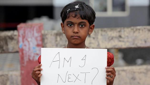 A gild holds a placard during a protest against the rape of an eight-year-old girl in Jammu’s Kathua, in Kochi on April 15, 2018. (Sivaram V / REUTERS) A gild holds a placard during a protest against the rape of an eight-year-old girl in Jammu’s Kathua, in Kochi on April 15, 2018. (Sivaram V / REUTERS)