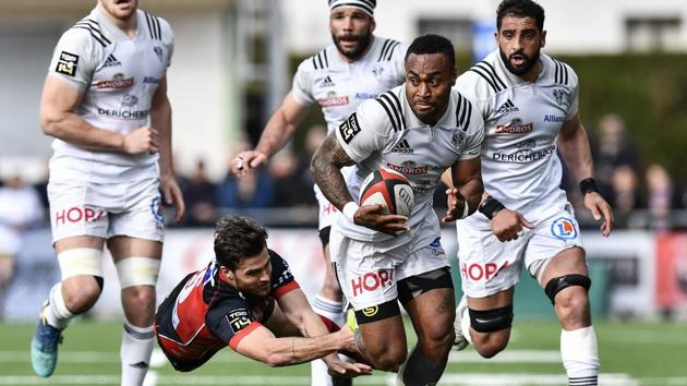 Brive's Fijian wing Benito Masilevu (2ndR) vies with Oyonnax's South-African fullback Bjorn Basson (2ndL) during the French Top 14 rugby union match US Oyonnax (USO) vs CA Brive at the Charles-Mathon stadium in Oyonnax, France on April 14, 2018. (Jeff Pachoud / AFP)