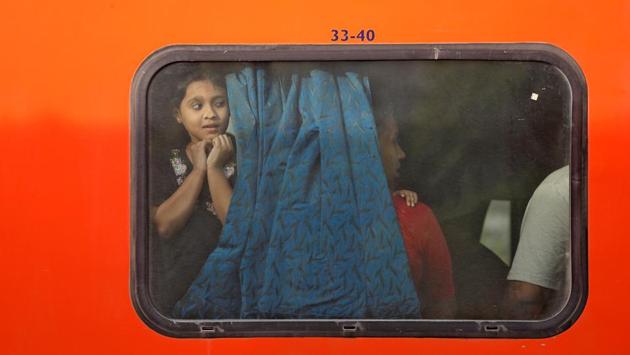 A girl peers through the window of a train parked at a railway station in New Delhi on April 20, 2018. (Saumya Khandelwal / REUTERS) A girl peers through the window of a train parked at a railway station in New Delhi on April 20, 2018. (Saumya Khandelwal / REUTERS)