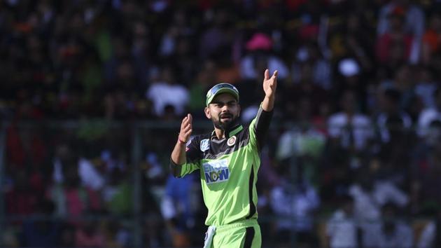 Royal Challengers Bangalore captain Virat Kohli gestures to his teammates during the VIVO IPL Twenty20 cricket match against Rajasthan Royals in Bangalore on April 15, 2018. (Aijaz Rahi / AP) Royal Challengers Bangalore captain Virat Kohli gestures to his teammates during the VIVO IPL Twenty20 cricket match against Rajasthan Royals in Bangalore on April 15, 2018. (Aijaz Rahi / AP)