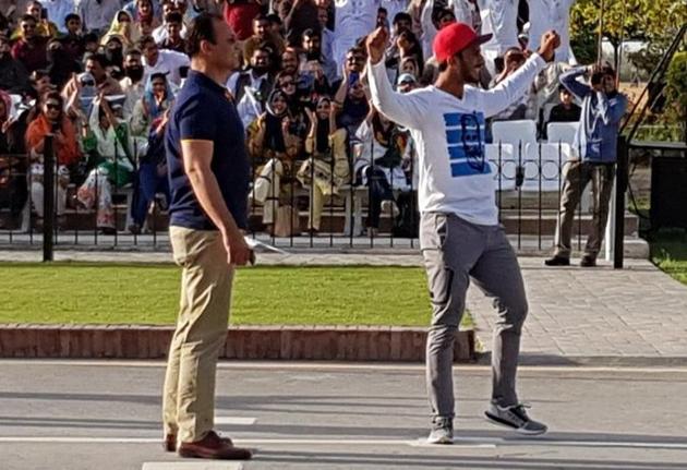 Pakistan cricketer Hasan Ali was seen showing off his trademark wicket celebration during the flag-lowering ceremony at the Wagah border on Saturday, which infuriated India’s Border Security Force officials.(Twitter/TheRealPCB)