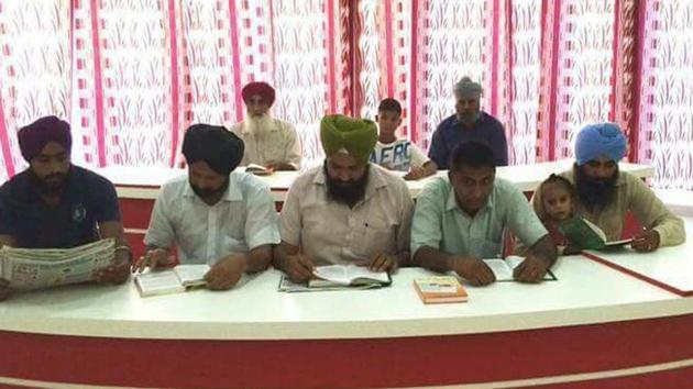 Visitors at the air-conditioned library at Chananwal village in Barnala.(HT Photo)