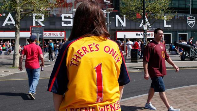 A supporter wears an Arsenal shirt with "There's only 1 Arsene Wenger" written on the back. (AFP) A supporter wears an Arsenal shirt with "There's only 1 Arsene Wenger" written on the back. (AFP)