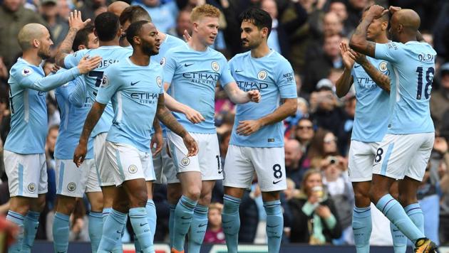 Manchester City's Kevin De Bruyne (C) celebrates after scoring against Swansea in their Premier League match on Sunday.(AFP)