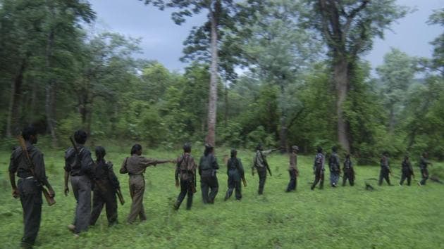 This August 2005 photo shows Maoist rebels patrolling the Nallamalla forests in Andhra Pradesh. (AP File Photo) This August 2005 photo shows Maoist rebels patrolling the Nallamalla forests in Andhra Pradesh. (AP File Photo)