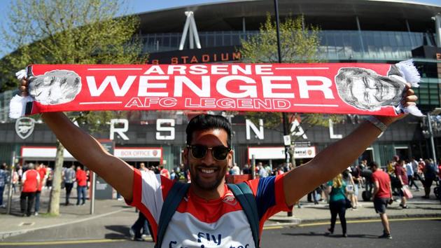 An Arsenal fan with a scarf featuring manager Arsene Wenger before the match. (REUTERS) An Arsenal fan with a scarf featuring manager Arsene Wenger before the match. (REUTERS)