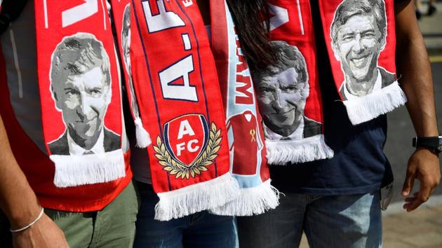 General view of scarves featuring Arsenal manager Arsene Wenger before the match against West Ham United. (REUTERS)