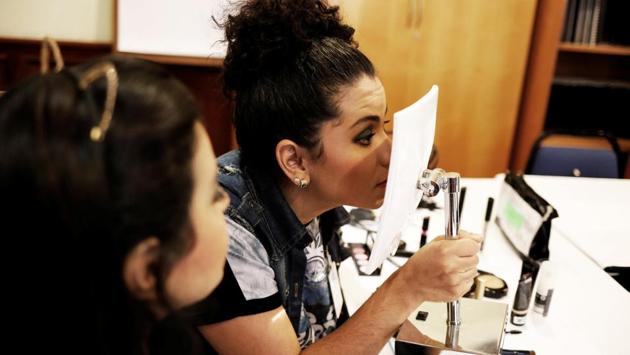 Ana (L) and Camila (R) while applying makeup during the workshop. “People say why do you put on makeup if you can’t see it. But I am so happy that I can do it confidently now,” said Ana, a 30-year-old housewife. (Nacho Doce / REUTERS) Ana (L) and Camila (R) while applying makeup during the workshop. “People say why do you put on makeup if you can’t see it. But I am so happy that I can do it confidently now,” said Ana, a 30-year-old housewife. (Nacho Doce / REUTERS)