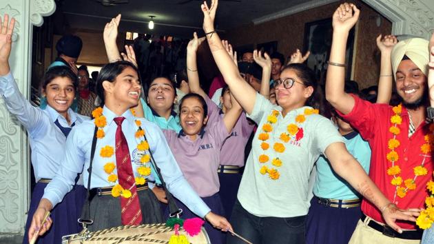 Students of Play Ways Senior Secondary School in jubilant mood after the declaration of the Class 12 results of PSEB, in Patiala. (Bharat Bhushan /HT)