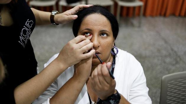 Flavia, 28, who is visually impaired, learns how to put kohl with the help of her teacher during the class. The free courses held at the Laramara association for blind people on the west side of Sao Paulo was offered by the Jacques Janine salon to help women overcome the challenges of doing their own makeup. (Nacho Doce / REUTERS) Flavia, 28, who is visually impaired, learns how to put kohl with the help of her teacher during the class. The free courses held at the Laramara association for blind people on the west side of Sao Paulo was offered by the Jacques Janine salon to help women overcome the challenges of doing their own makeup. (Nacho Doce / REUTERS)