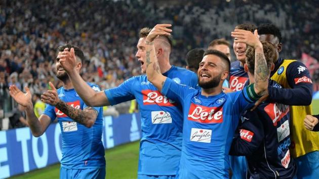 Napoli's Piotr Zielinski and Lorenzo Insigne celebrate after the win over Juventus with teammates and fans in Turin on Sunday.(REUTERS)