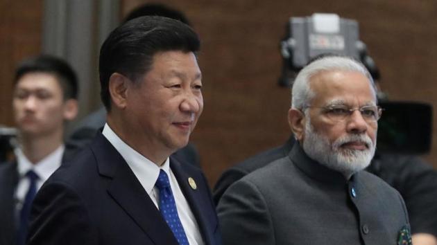 Chinese President Xi Jinping (L) and Prime Minister Narendra Modi arrive for an event on the sidelines of the 2017 BRICS Summit in Xiamen, Fujian province. (Reuters File) Chinese President Xi Jinping (L) and Prime Minister Narendra Modi arrive for an event on the sidelines of the 2017 BRICS Summit in Xiamen, Fujian province. (Reuters File)