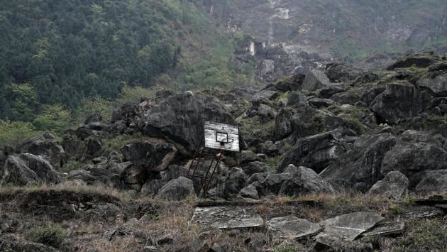 A basketball hoop is seen at the site of Beichuan Middle School which was buried by boulders in 2008. Some of the most heart-wrenching stories from the 2008 quake came from the schools which collapsed, crushing children alive. (Jason Lee / REUTERS)