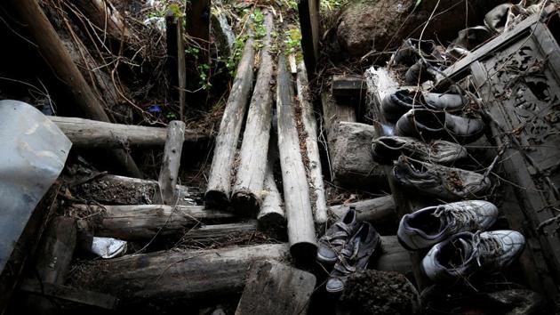 Abandoned shoes are seen in an old dwelling at a minority village. The local government is supporting villagers to develop leisure and tourism industries after the quake, and many quake survivors have turned their newly-built houses into inns. (Jason Lee / REUTERS)