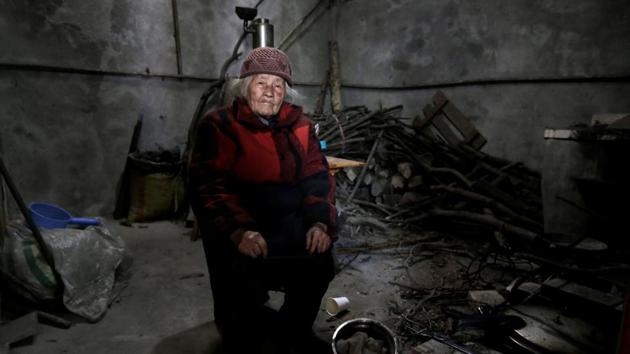 Liu Guizhen, 95, and her 106-year-old husband Wang Guanneng both survived the quake that killed their adopted son and daughter-in-law. Liu said a rock flew over her head when the quake struck as she was busy working in the fields, leaving her unscathed. Liu says she makes some money from selling eggs to tourists. (Jason Lee / REUTERS)