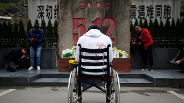Zheng Haiyang, now 27, lost both his legs after being buried in Beichuan Middle School, where he was trapped for more than 22 hours. “I still feel sad now when I think of that time, but I am in a good condition now,” Zheng said. He now works for an Internet company in Chengdu providing services to disabled people. (Jason Lee / REUTERS)